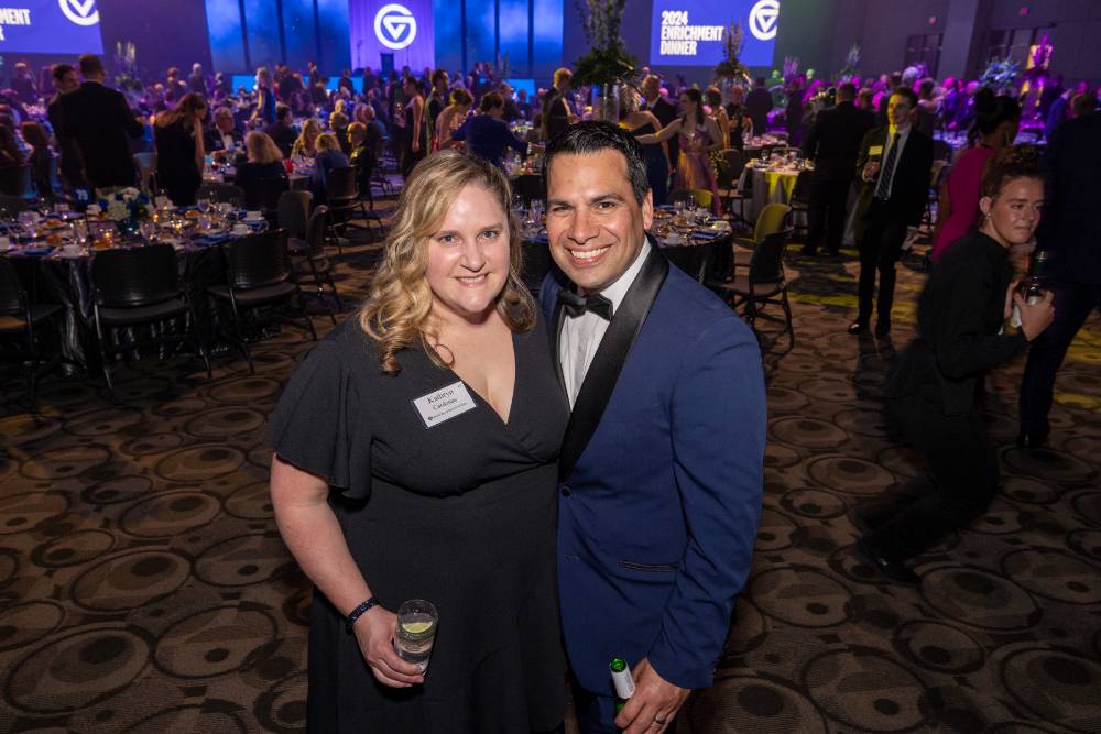 Couple smiling at camera during event